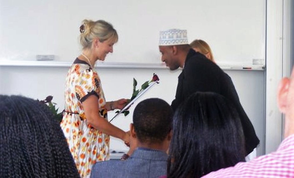 Photo: Omar Mwalim receives his Master’s degree from his supervisor Britt Pinkowski Tersbøl, Associate Professor, Department of Public Health and Medical Sciences, 2009. 